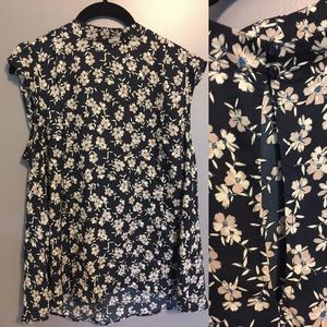 Floral mock neck blouse w/ keyhole back.Sleeveless